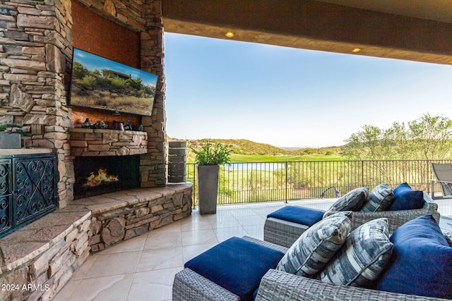 view of patio / terrace featuring an outdoor stone fireplace