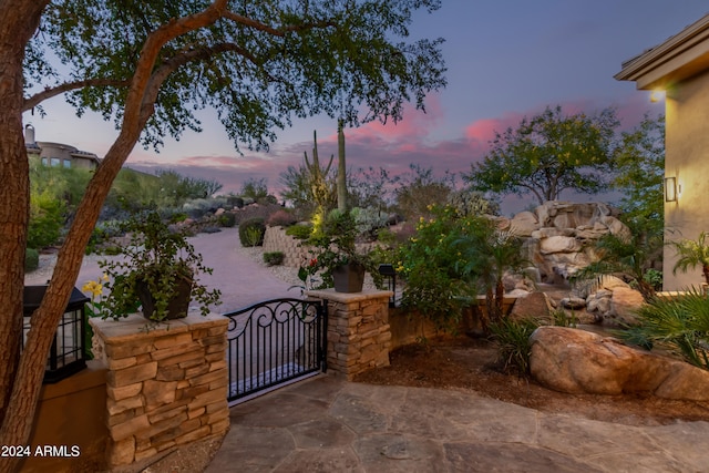 view of patio terrace at dusk