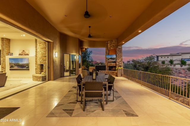 view of patio with a balcony and ceiling fan