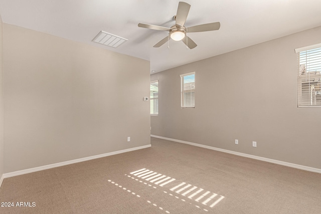 spare room with carpet flooring and ceiling fan