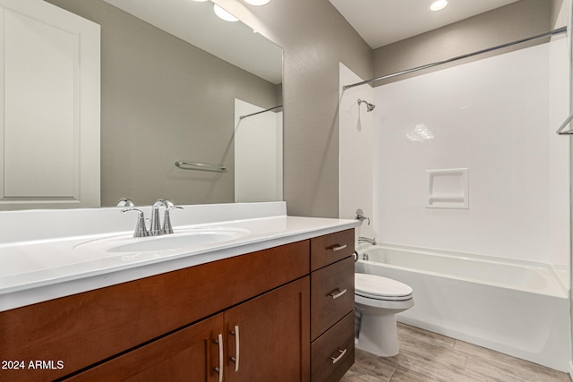 full bathroom featuring shower / tub combination, vanity, and toilet