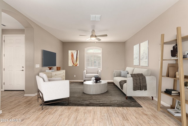 living room featuring ceiling fan and light wood-type flooring