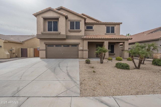 mediterranean / spanish house featuring a garage