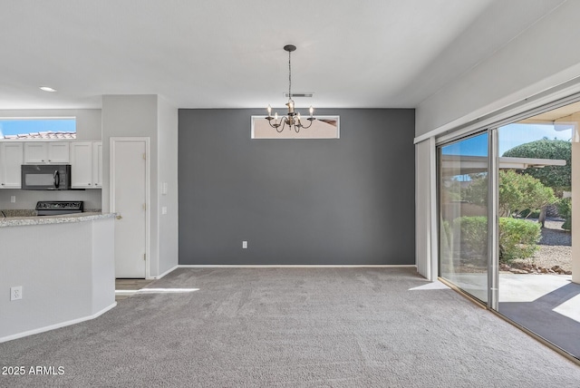 interior space with plenty of natural light, light carpet, and a notable chandelier