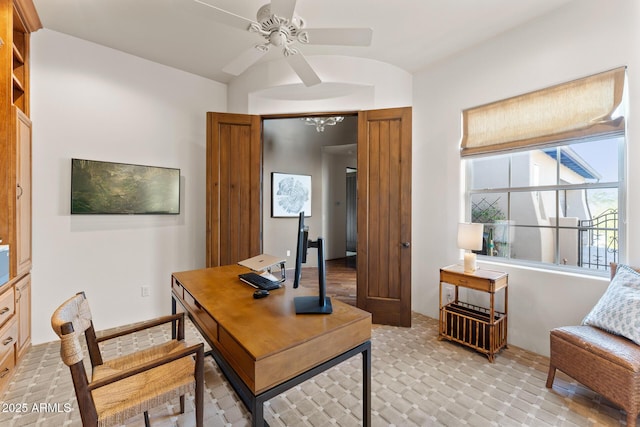 office area with a ceiling fan and vaulted ceiling