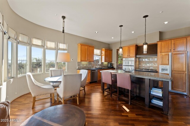 dining space featuring dark wood-style floors and recessed lighting