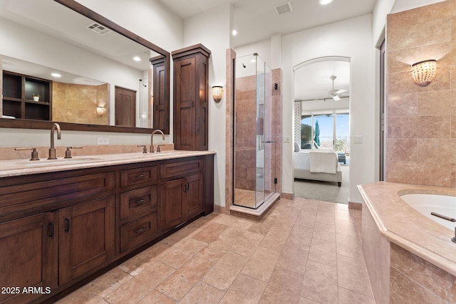 full bath featuring a stall shower, visible vents, and a sink