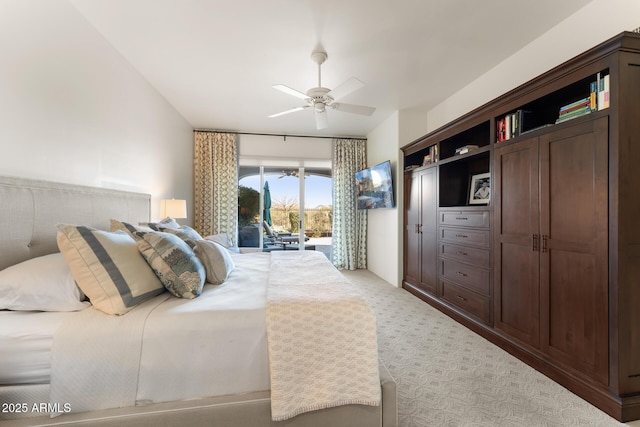 bedroom featuring light carpet, access to outside, and a ceiling fan