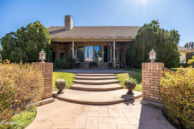 25509 S Lime Dr, Queen Creek, AZ 85142 - exterior space featuring a patio, a chimney, and a front lawn