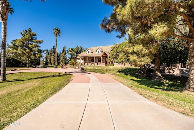 25509 S Lime Dr, Queen Creek, AZ 85142 - view of front of house with a front yard and brick siding