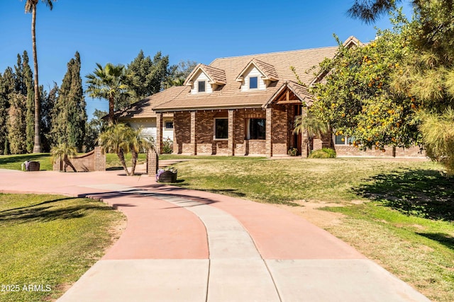 25509 S Lime Dr, Queen Creek, AZ 85142 - view of front facade with brick siding, a front lawn, and concrete driveway