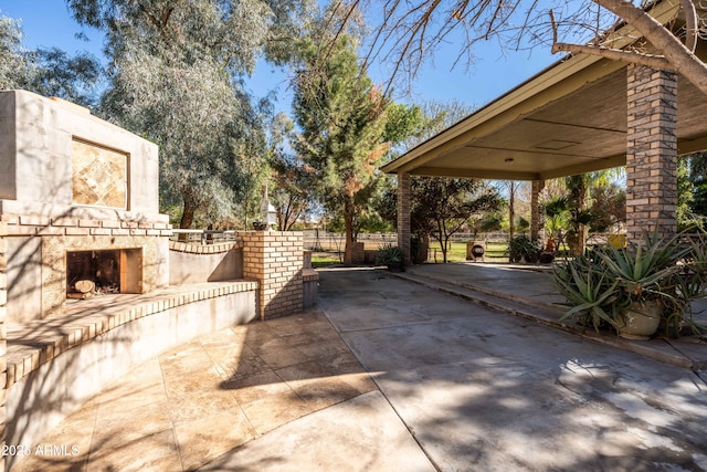 25509 S Lime Dr, Queen Creek, AZ 85142 - view of patio with an outdoor stone fireplace