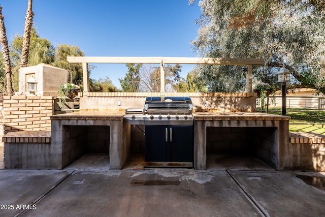 25509 S Lime Dr, Queen Creek, AZ 85142 - view of patio / terrace with exterior kitchen, driveway, grilling area, a garage, and fence