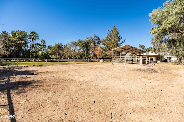 25509 S Lime Dr, Queen Creek, AZ 85142 - view of yard with an enclosed area, an outdoor structure, an exterior structure, and a rural view