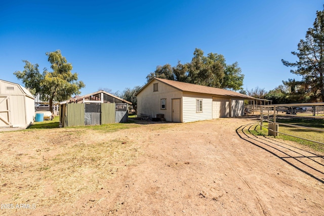 25509 S Lime Dr, Queen Creek, AZ 85142 - exterior space with a detached garage and an outdoor structure