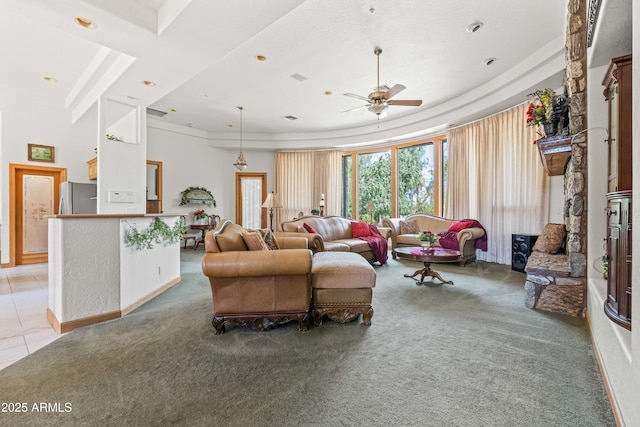 25509 S Lime Dr, Queen Creek, AZ 85142 - living room with a tray ceiling, a ceiling fan, light carpet, and light tile patterned floors