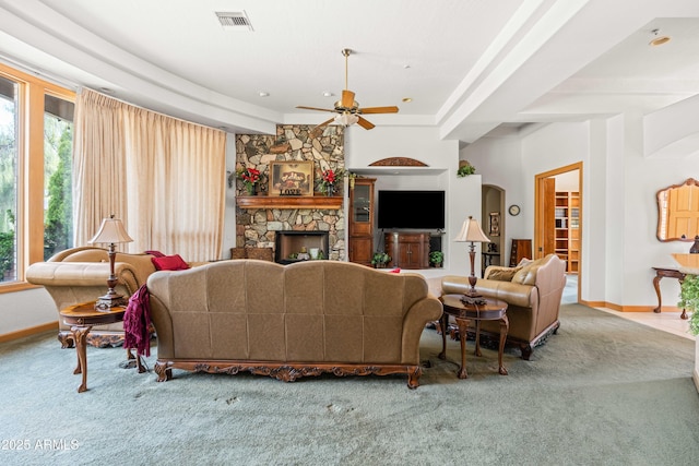 25509 S Lime Dr, Queen Creek, AZ 85142 - living area featuring baseboards, a stone fireplace, carpet floors, visible vents, and ceiling fan