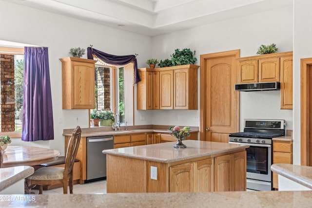 25509 S Lime Dr, Queen Creek, AZ 85142 - kitchen with light stone countertops, a kitchen island, under cabinet range hood, a sink, and stainless steel appliances