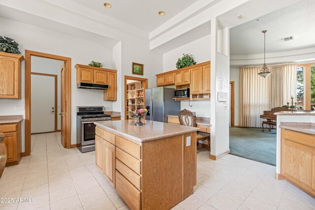 25509 S Lime Dr, Queen Creek, AZ 85142 - kitchen featuring a center island, appliances with stainless steel finishes, under cabinet range hood, a towering ceiling, and light tile patterned flooring