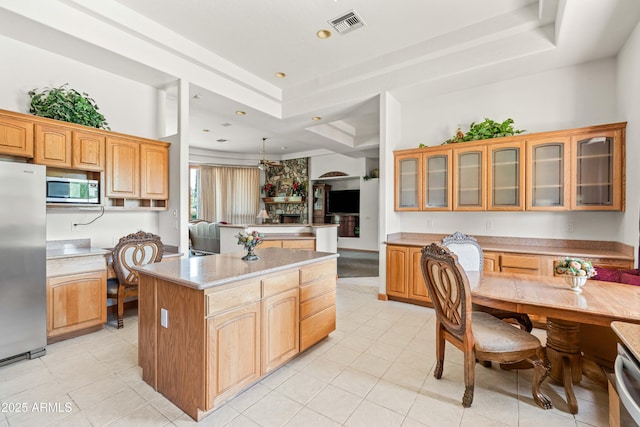 25509 S Lime Dr, Queen Creek, AZ 85142 - kitchen featuring a kitchen island, visible vents, a raised ceiling, and appliances with stainless steel finishes