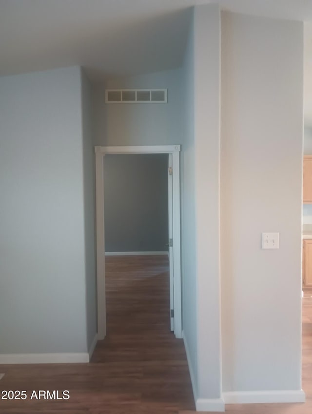 corridor featuring dark hardwood / wood-style floors