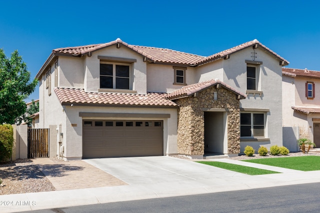 mediterranean / spanish-style house featuring a garage