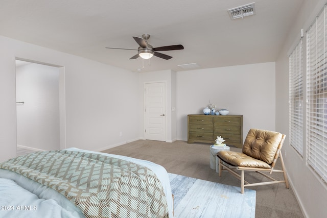 bedroom with light carpet and ceiling fan