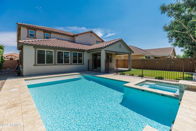 view of swimming pool with an in ground hot tub and a patio