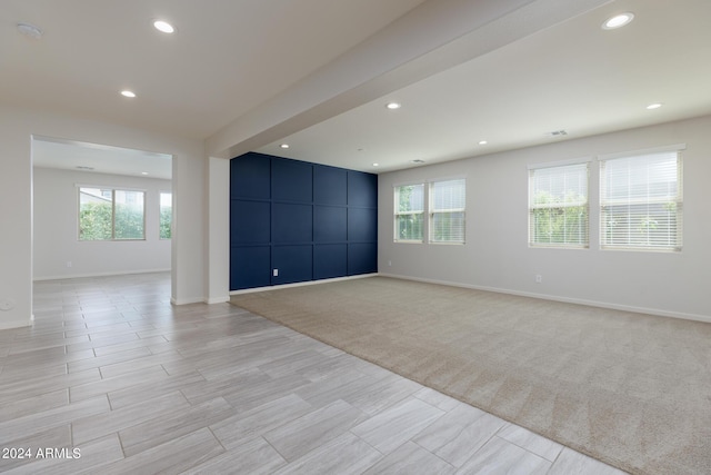 empty room featuring light colored carpet