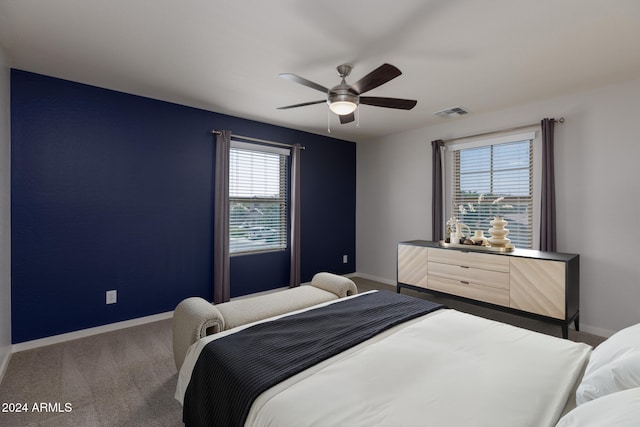 carpeted bedroom with ceiling fan