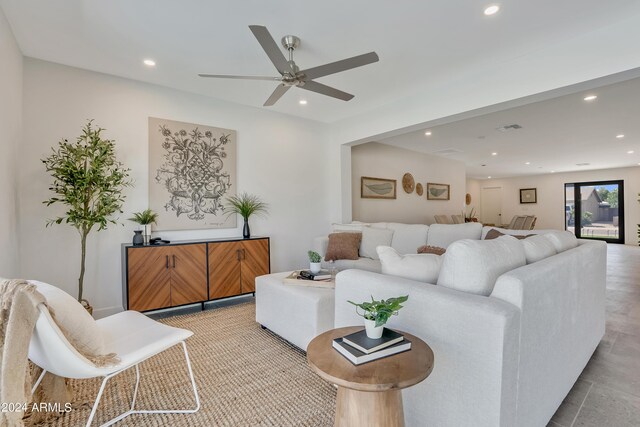 living area featuring lofted ceiling and light tile patterned flooring