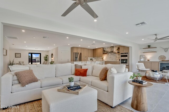 bedroom featuring ceiling fan and a barn door