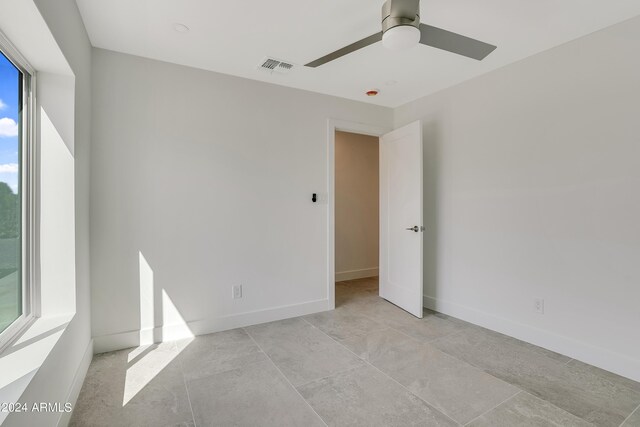 bathroom featuring tile walls, tile patterned floors, and shower with separate bathtub