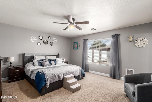 1950 E Dust Devil Dr, San Tan Valley, AZ 85143 - bedroom featuring light carpet, baseboards, a textured ceiling, and ceiling fan