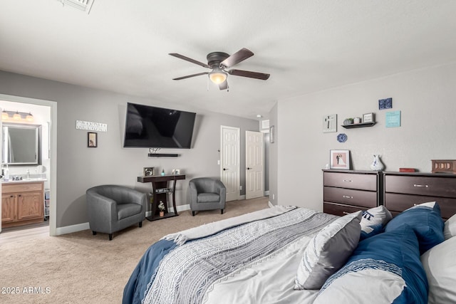 1950 E Dust Devil Dr, San Tan Valley, AZ 85143 - bedroom with light carpet, baseboards, connected bathroom, and ceiling fan