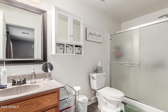 1950 E Dust Devil Dr, San Tan Valley, AZ 85143 - bathroom featuring toilet, a stall shower, and vanity