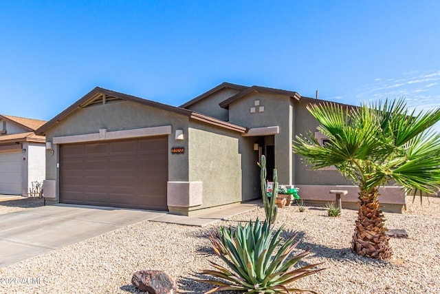 1950 E Dust Devil Dr, San Tan Valley, AZ 85143 - view of front of home featuring an attached garage, stucco siding, and concrete driveway