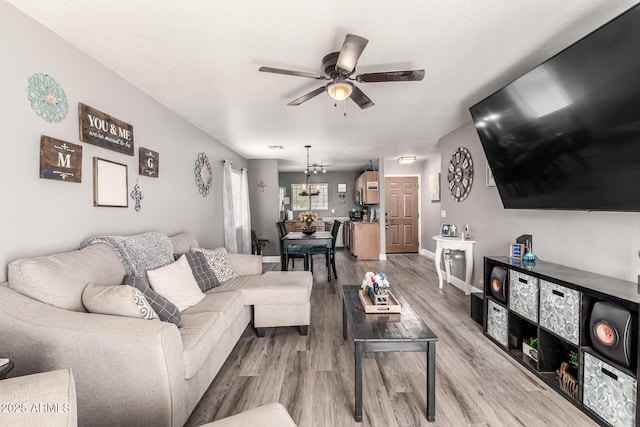 1950 E Dust Devil Dr, San Tan Valley, AZ 85143 - living area featuring a ceiling fan, light wood-type flooring, and baseboards