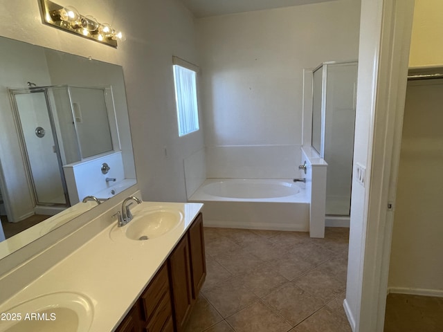 full bath with tile patterned flooring, a sink, a shower stall, a bath, and double vanity