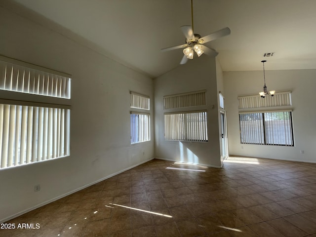 spare room featuring high vaulted ceiling, a healthy amount of sunlight, visible vents, and ceiling fan with notable chandelier