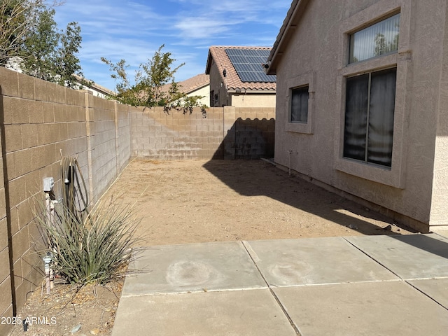 view of yard featuring a patio area and a fenced backyard