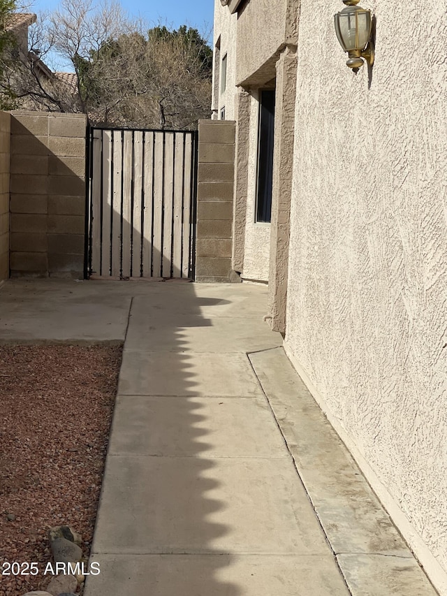 view of gate with fence