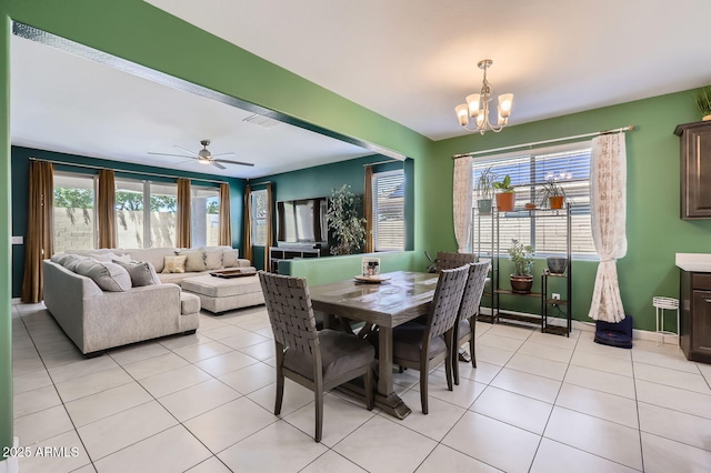 23730 W Hess Ave, Buckeye, AZ 85326 - dining space with a chandelier, light tile patterned floors, ceiling fan, and baseboards