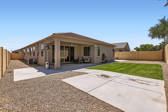 23730 W Hess Ave, Buckeye, AZ 85326 - back of property with stucco siding, central air condition unit, a fenced backyard, and a patio area