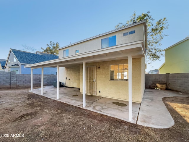 rear view of house featuring a patio area