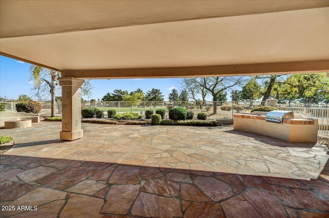 view of patio with a grill and an outdoor kitchen