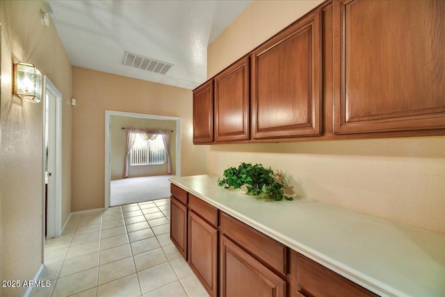 kitchen with light tile patterned floors