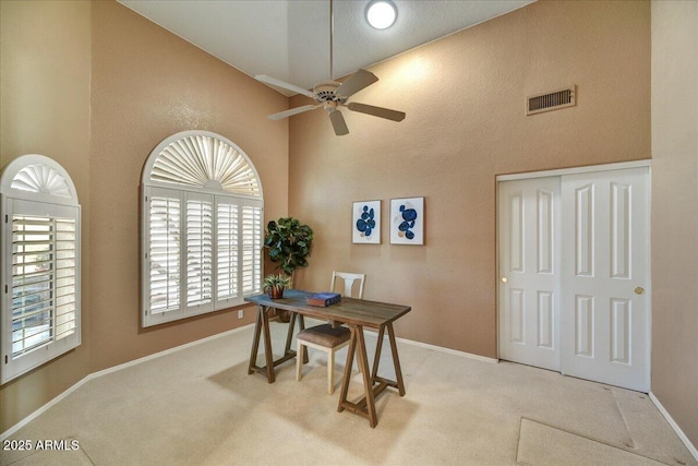 home office featuring ceiling fan, light colored carpet, and high vaulted ceiling