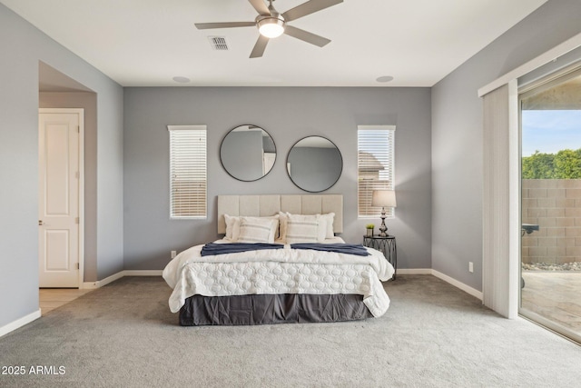 bedroom with visible vents, multiple windows, baseboards, and carpet floors