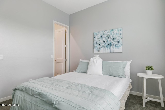 bedroom with baseboards and carpet